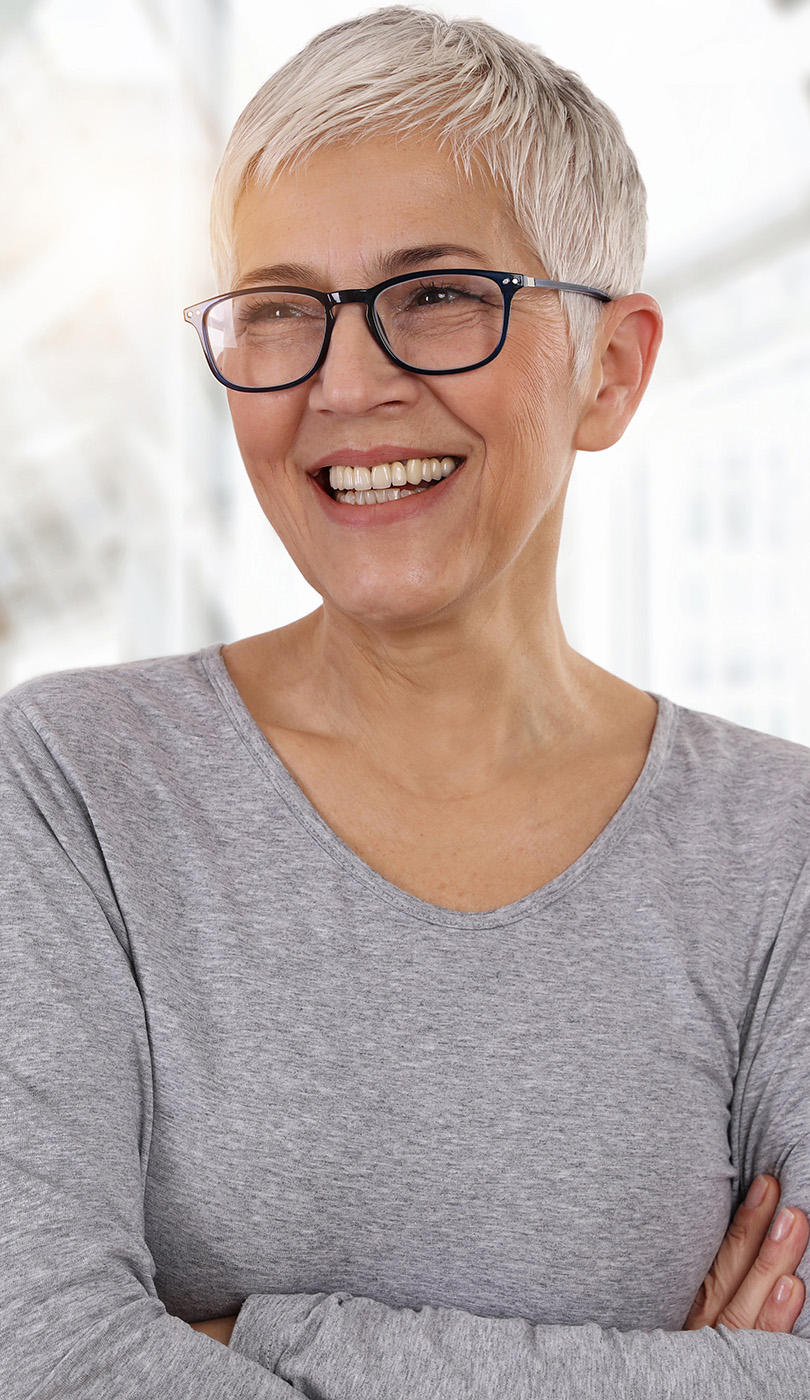 The image shows a modern dental or medical office interior with a dental chair, equipment, and a clean, professional environment.